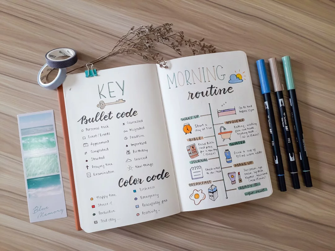 Brain-Friendly Morning Routines That Boost Focus Without 5 a.m. Wakeups Open book with handwritten notes and scissors beside it, illustrating FAQs on a scientifically proven best morning routine