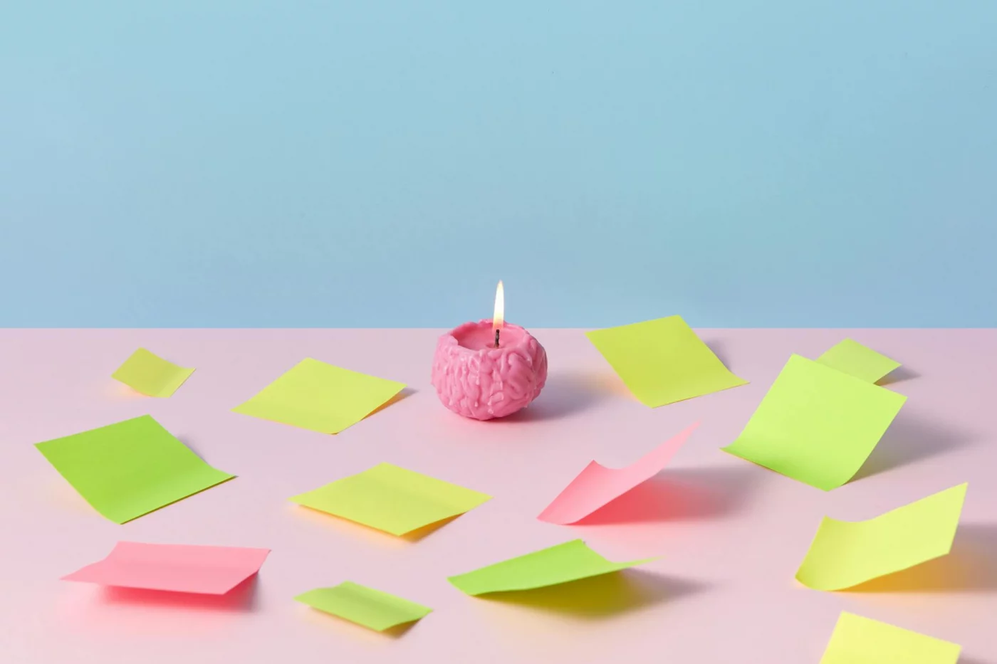 Stress, Focus, and Brain Health: 7 Practical Ways to Recover Pink brain candle among colorful sticky notes, symbolizing stress and memory problems and 7 steps to regain focus