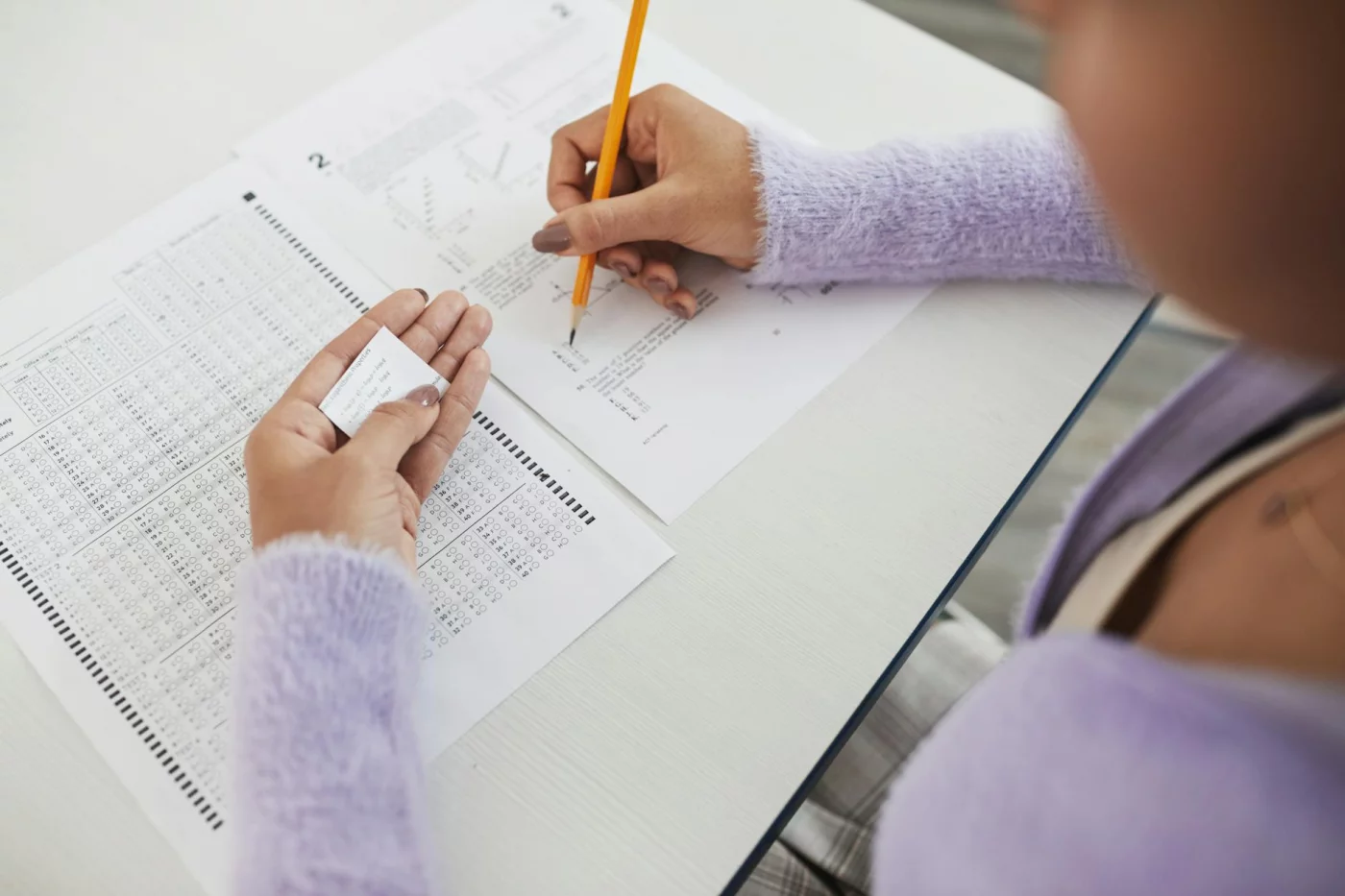 Student reviewing exam notes, highlighting common questions when creating a study schedule template