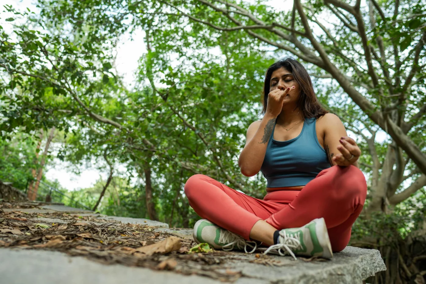 Amygdala Hijack Explained: What It Is and How to Calm It Meditating in nature shows 1 of 7 ways to calm your response when learning what is the amygdala hijack