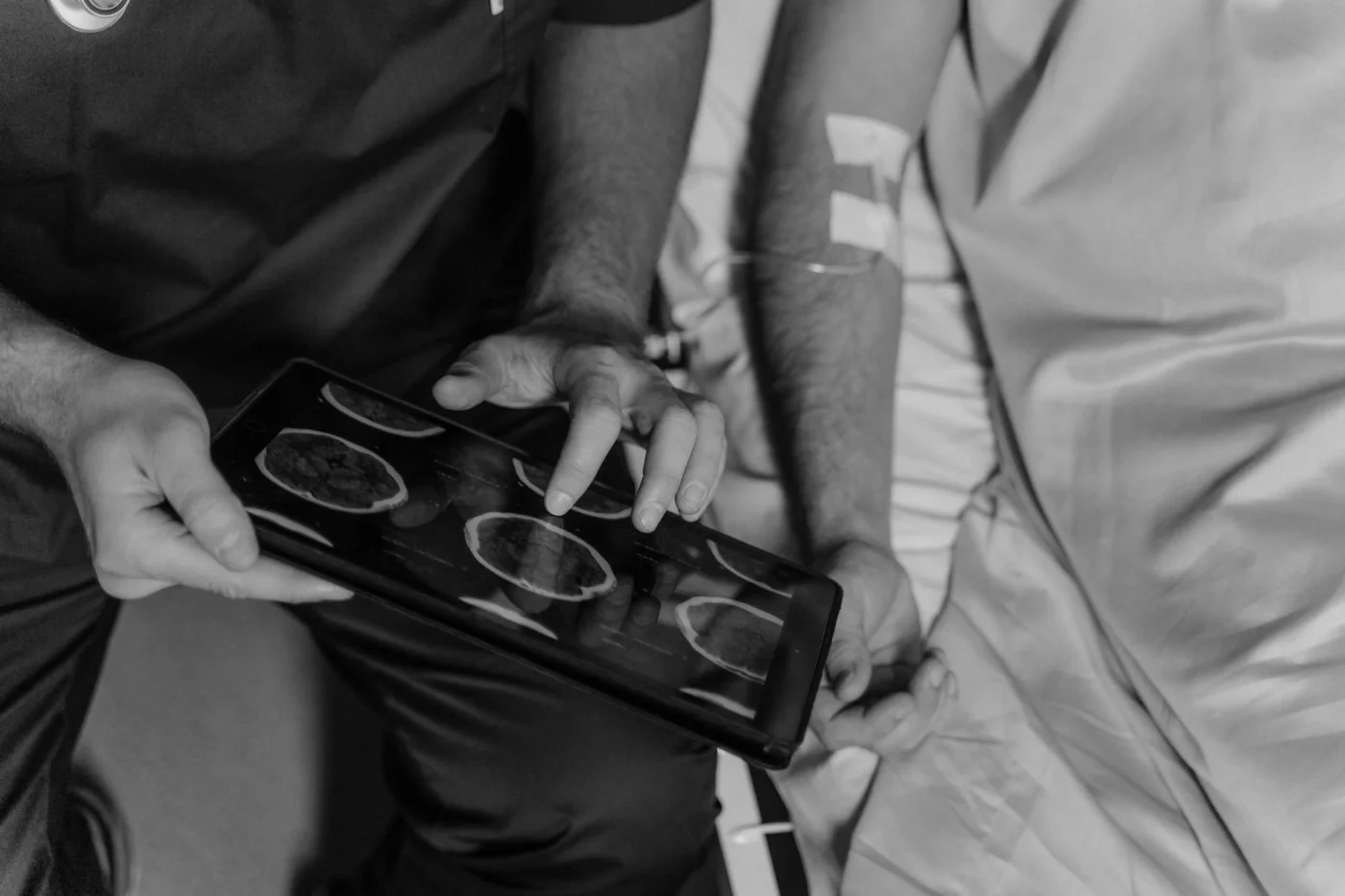 What Part of the Brain Is Responsible for Memory, Stress, Speech, and More? Doctor reviews grayscale CT scans while explaining what part of the brain is responsible for stress and memory