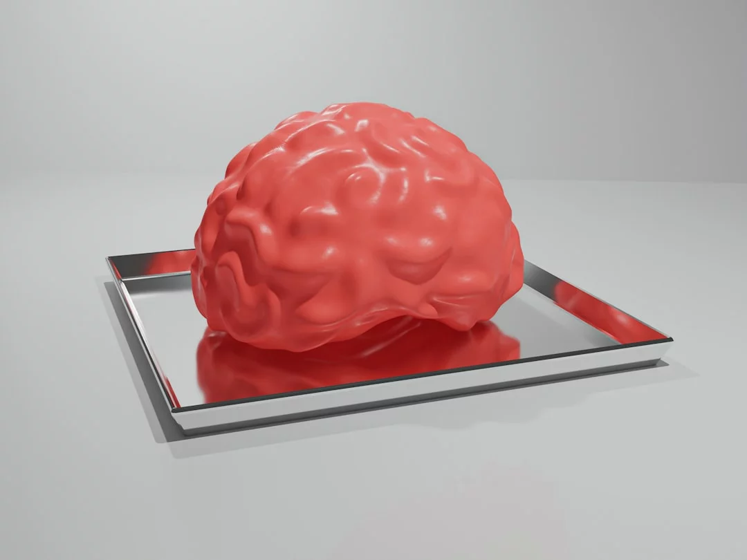 Why Emotional Events Feel So Unforgettable Red brain on a metal tray illustrating why do we remember emotional events better, even when memories are wrong