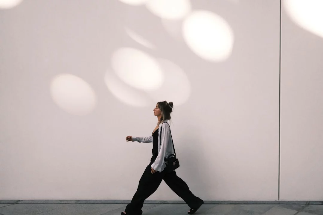 Which Exercises Best Improve Focus, Memory, and Stress Relief? Woman walking along a sidewalk, a simple example of the best exercise for stress and anxiety