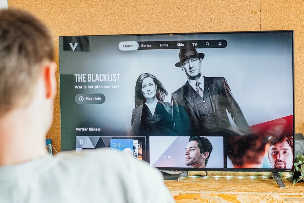 Man watching The Blacklist on TV while learning how to use TV shows to learn a language