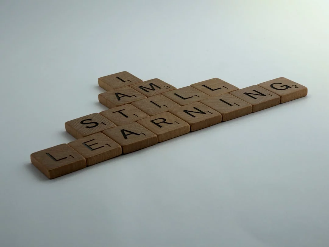 Brown wooden blocks on a white table illustrate how learning a skill can increase brain power in 7 minutes