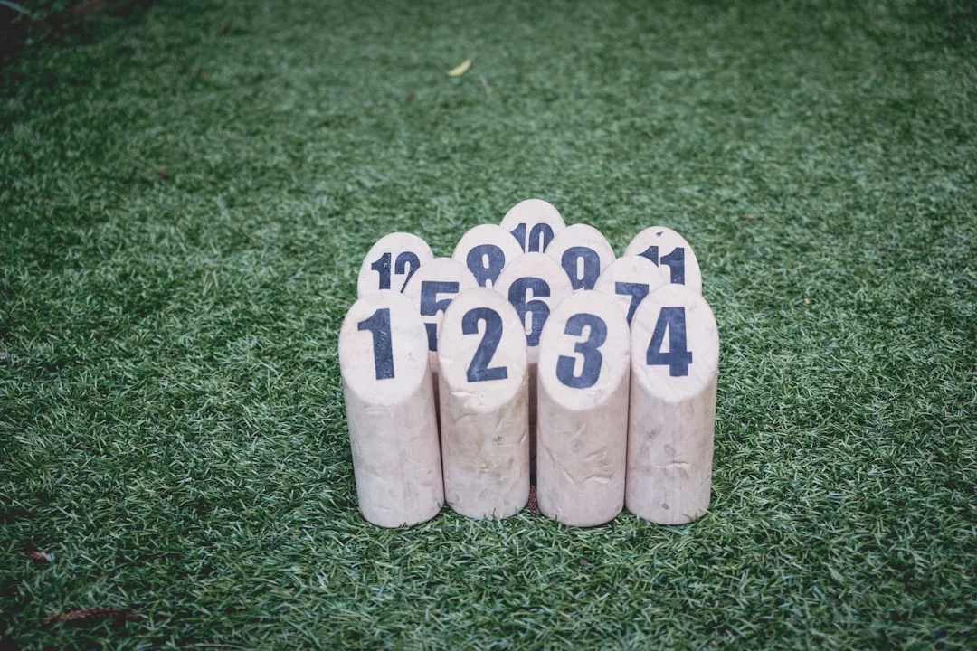 How to Build a Personal Peg System for Numbers You Need to Remember White wooden blocks on green lawn illustrating peg system 1-100 for practical study and memory practice