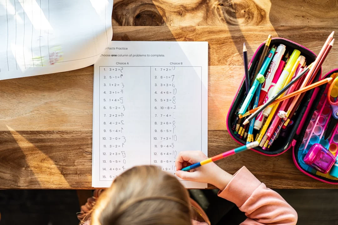How to Build a Personal Peg System for Numbers You Need to Remember Little girl at a table with a bag of pencils, illustrating peg system 1-100 FAQs for beginners