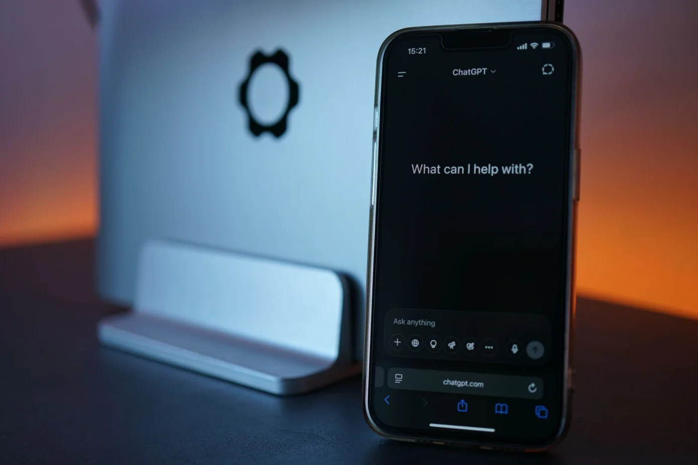 How to Use ChatGPT for Study Skills Without Weakening Learning Smartphone chat interface illustrating FAQs about chatgpt prompts for learning skills with laptop in background