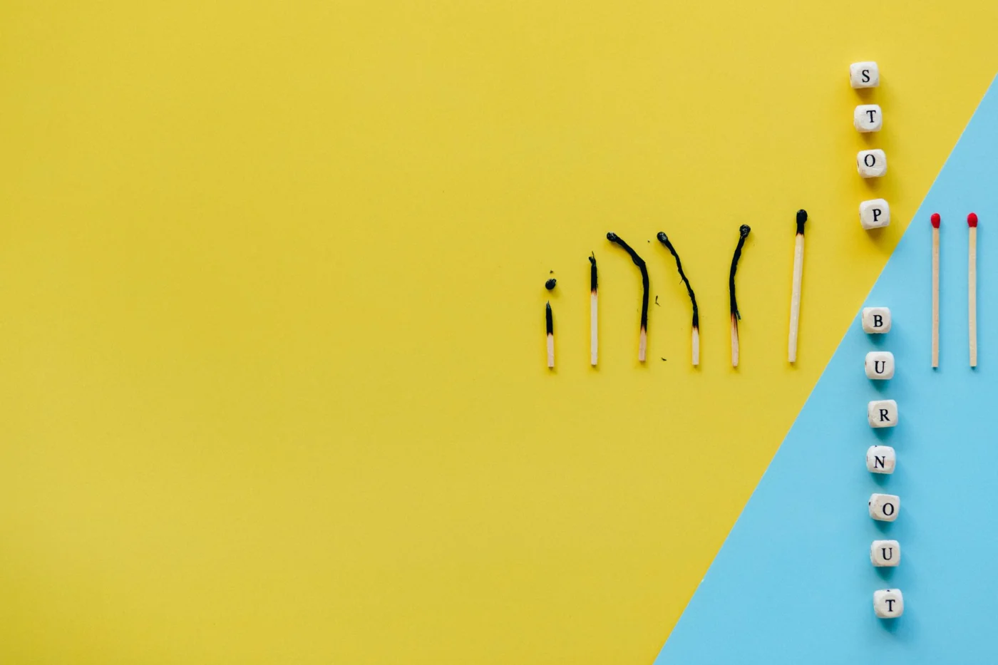 Early Signs of Burnout at Work You Might Be Ignoring STOP BURNOUT blocks and burned matches illustrating early signs of burnout at work in an FAQ guide