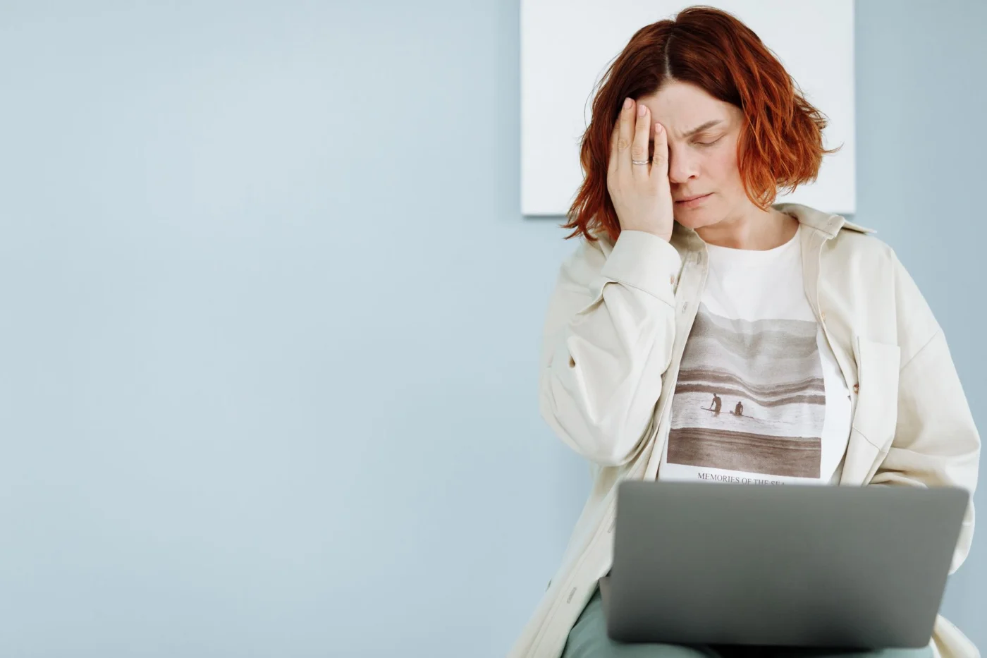 Problem-Focused vs Emotion-Focused Coping for Stress and Focus Woman at a laptop holding her forehead, illustrating problem focused vs emotion focused coping under stress