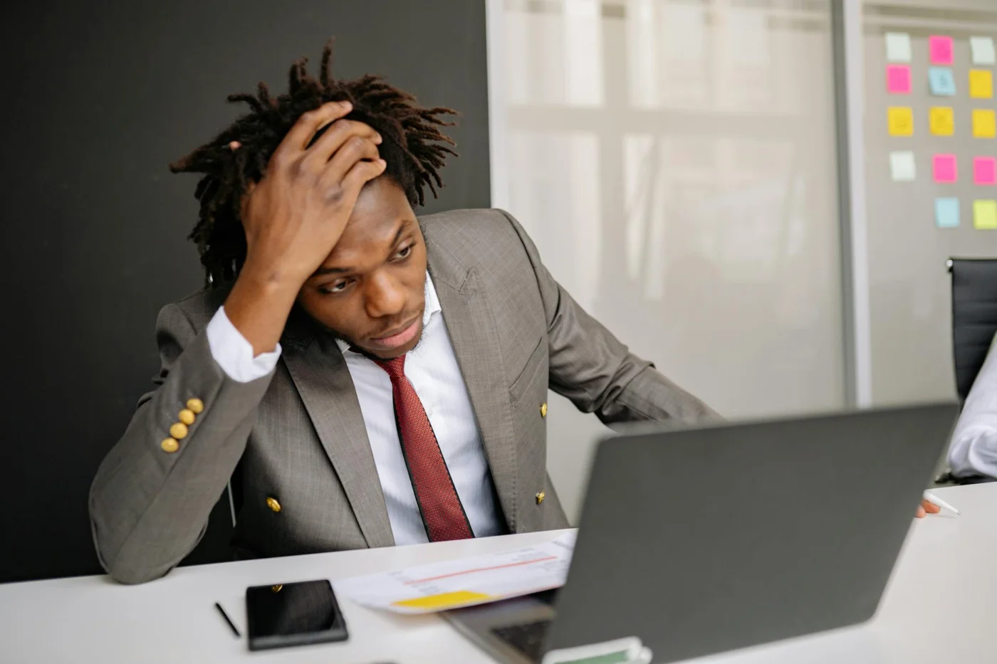 Problem-Focused vs Emotion-Focused Coping for Stress and Focus Businessman looking worried at his laptop, illustrating problem focused vs emotion focused coping at work