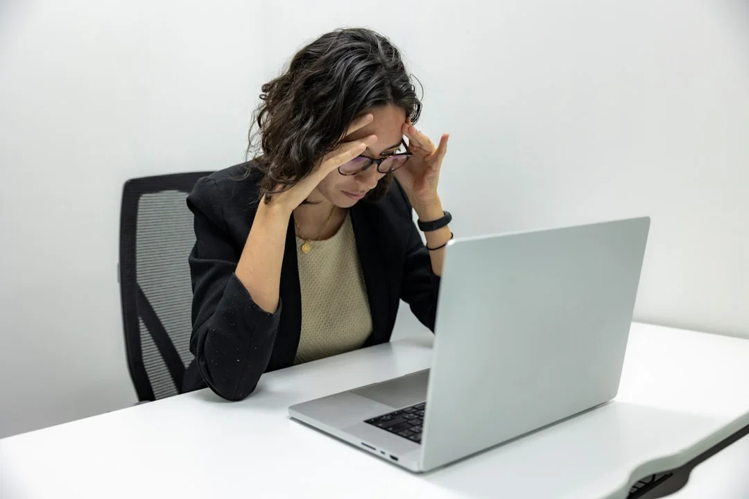 Why You Forget Names Under Stress and How to Improve Recall Woman at a laptop making memory mistakes that may explain why am i forgetting names all of a sudden